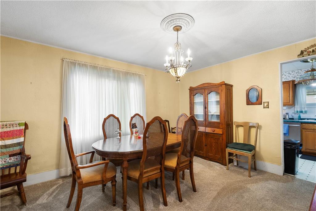330 Main Street Richeyville, PA 15358 - Photo 5 of 28 a view of a dining room with furniture and chandelier