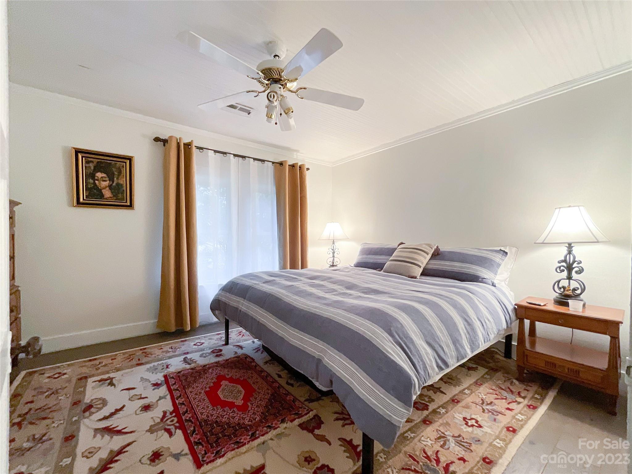5100 Tabernacle Road Lancaster, SC 29720 - Photo 11 of 39 a bedroom with a bed and a lamp