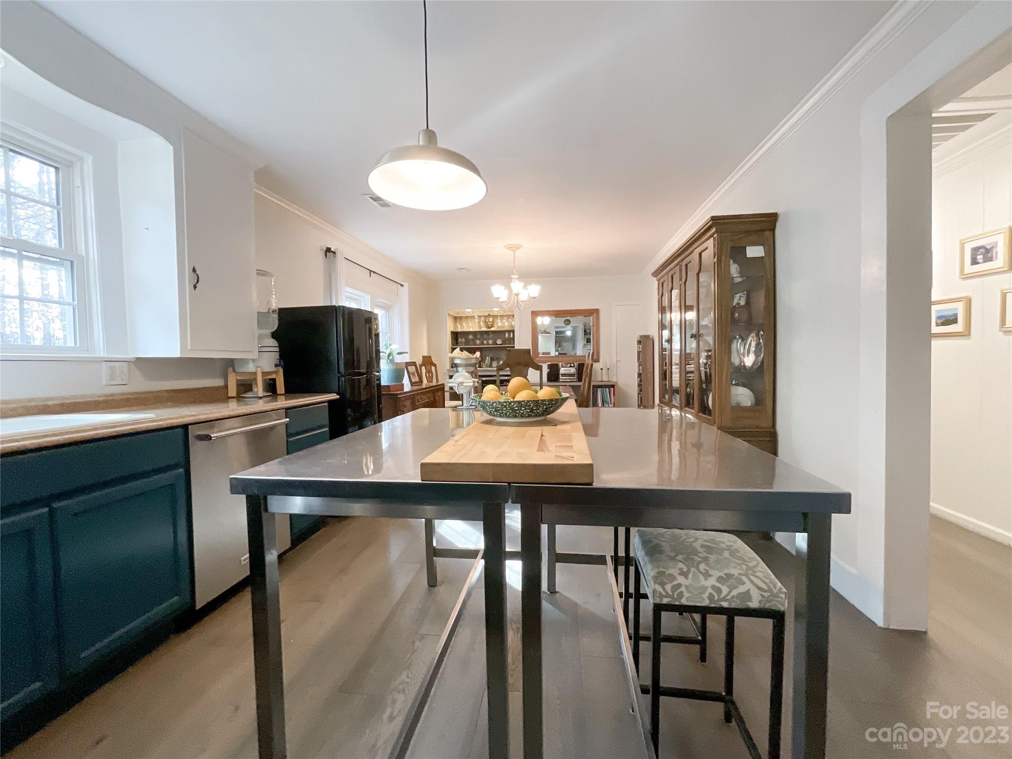 5100 Tabernacle Road Lancaster, SC 29720 - Photo 21 of 39 a kitchen with kitchen island a dining table and chairs