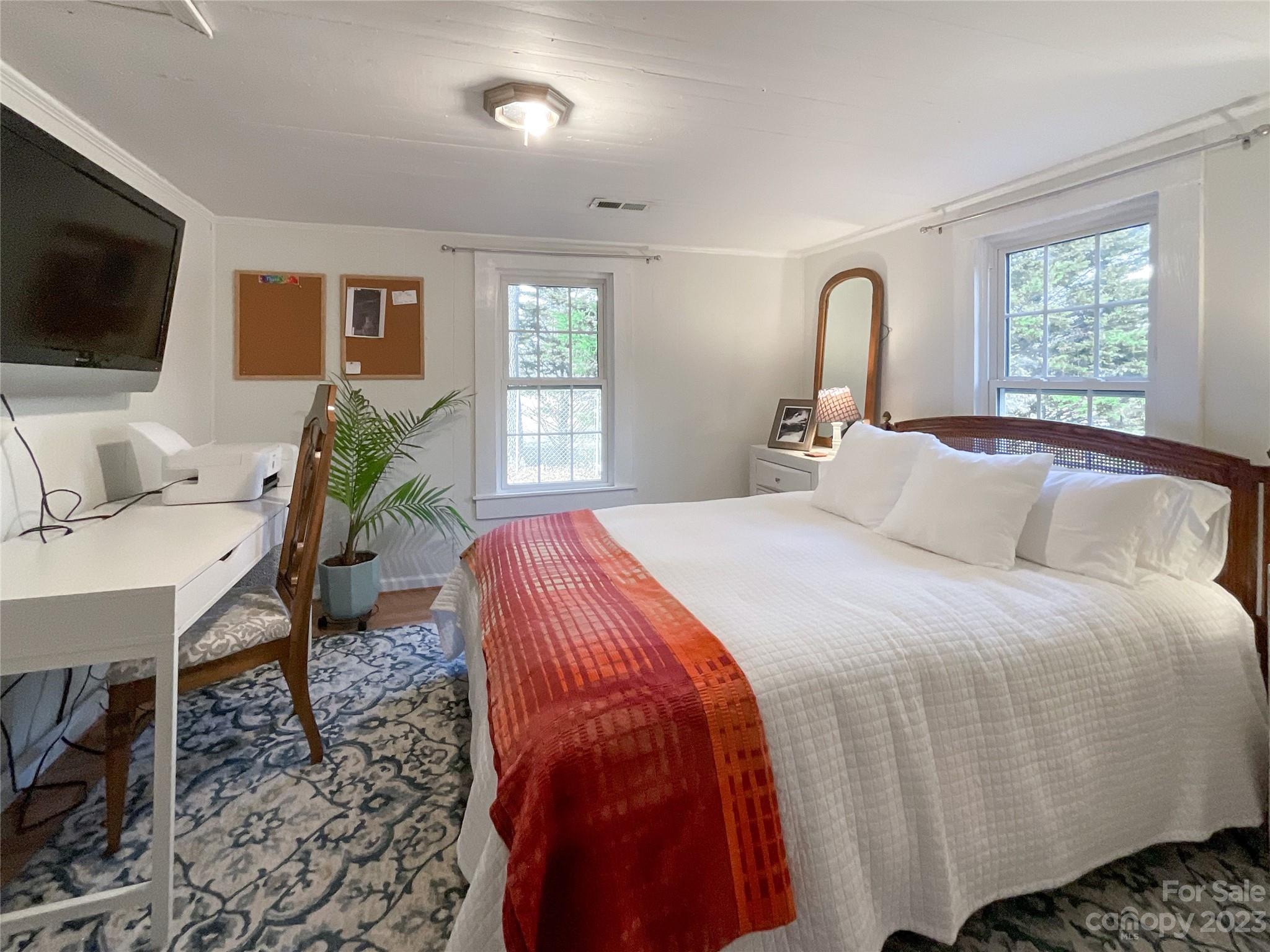 5100 Tabernacle Road Lancaster, SC 29720 - Photo 26 of 39 a bedroom with a large bed and a flat screen tv