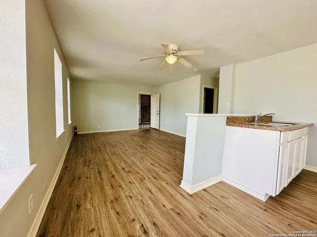 a view of a livingroom with wooden floor