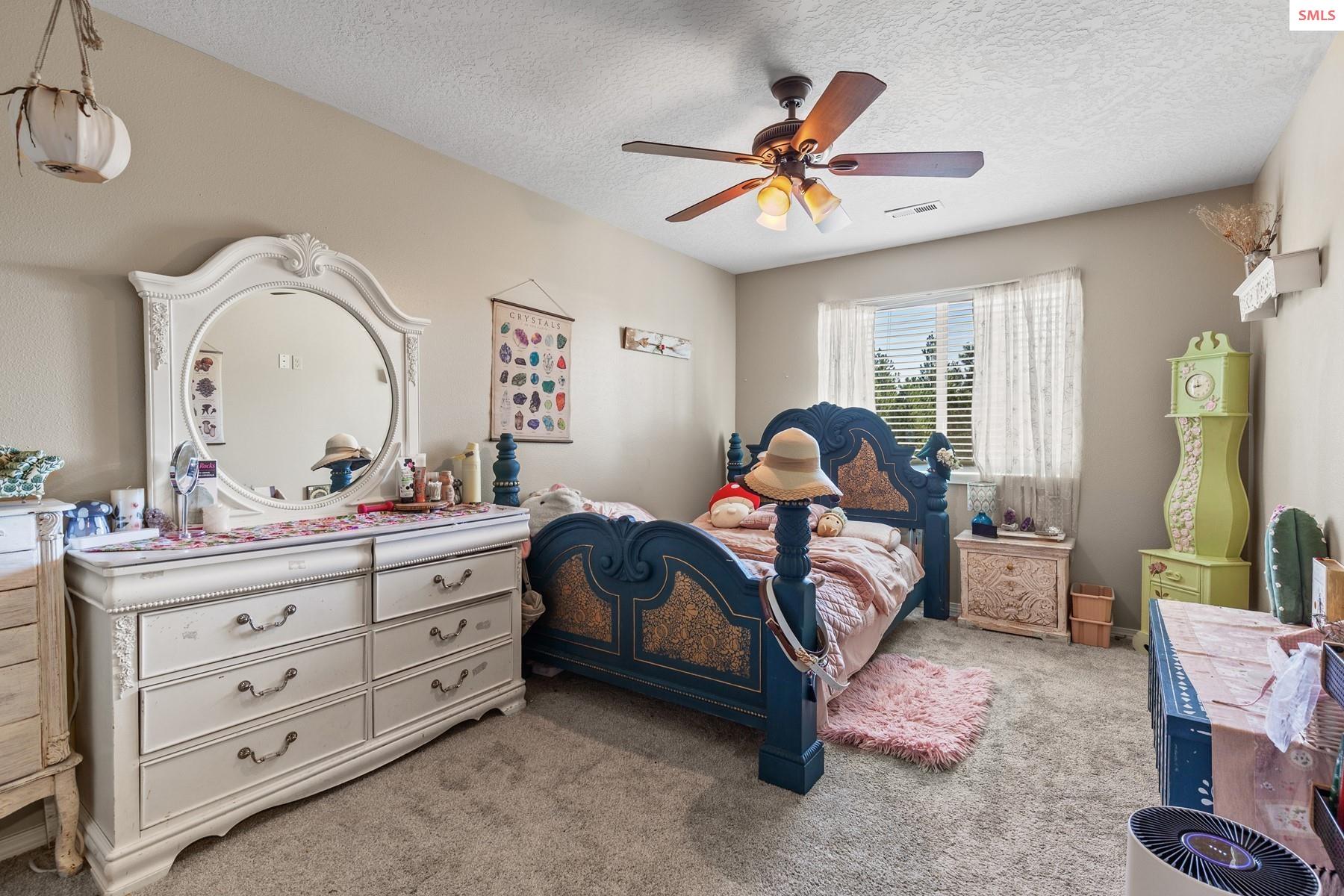 18341 West Highway 53 Rathdrum, ID 83858 - Photo 28 of 41 Big upstairs bedroom with ceiling fan.