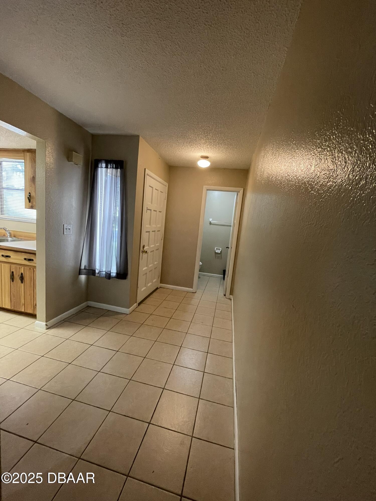 112 Tomoka Meadows Boulevard Ormond Beach, FL 32174 - Photo 17 of 53 a view of a hallway