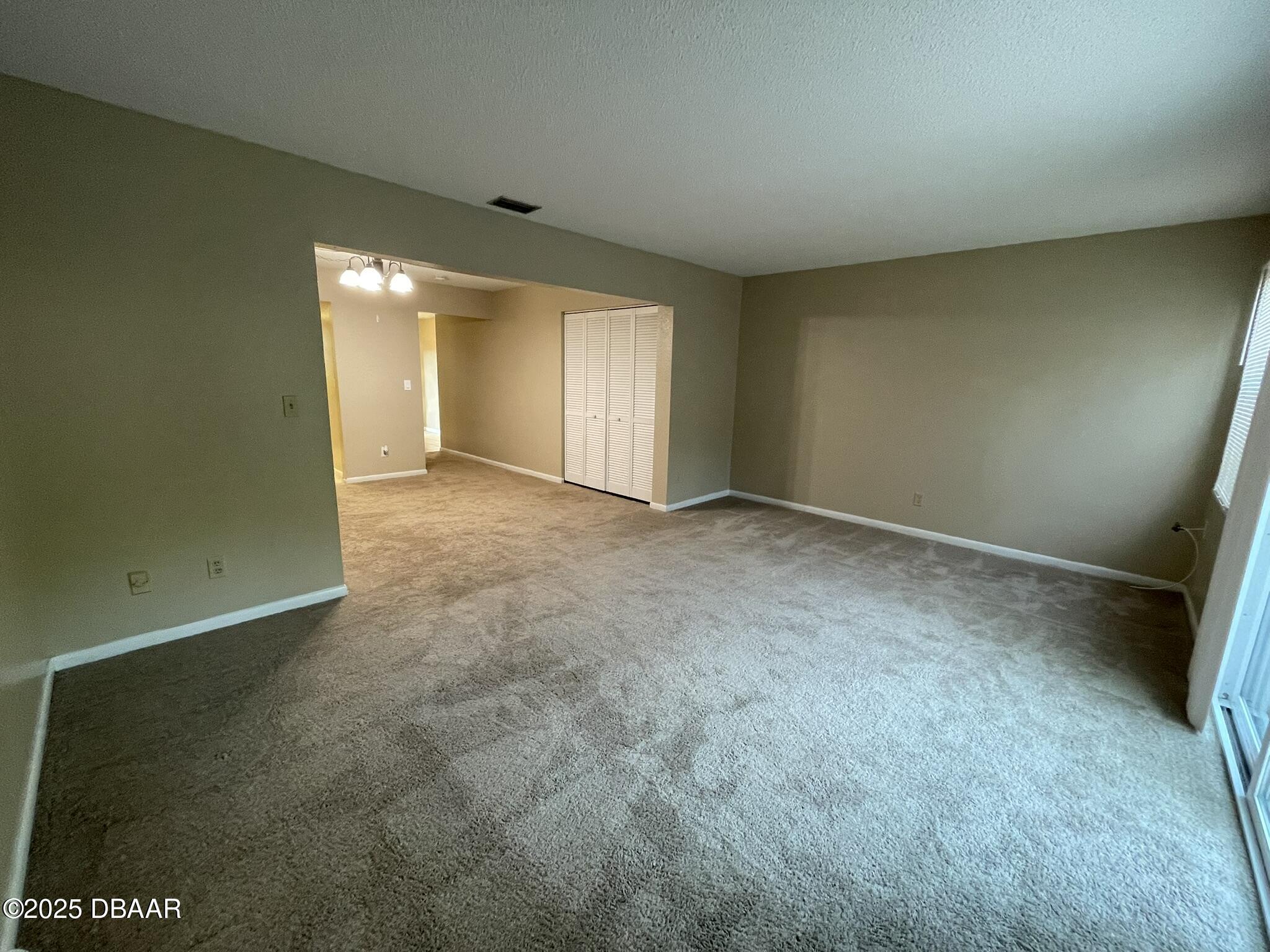 112 Tomoka Meadows Boulevard Ormond Beach, FL 32174 - Photo 23 of 53 an empty room with windows