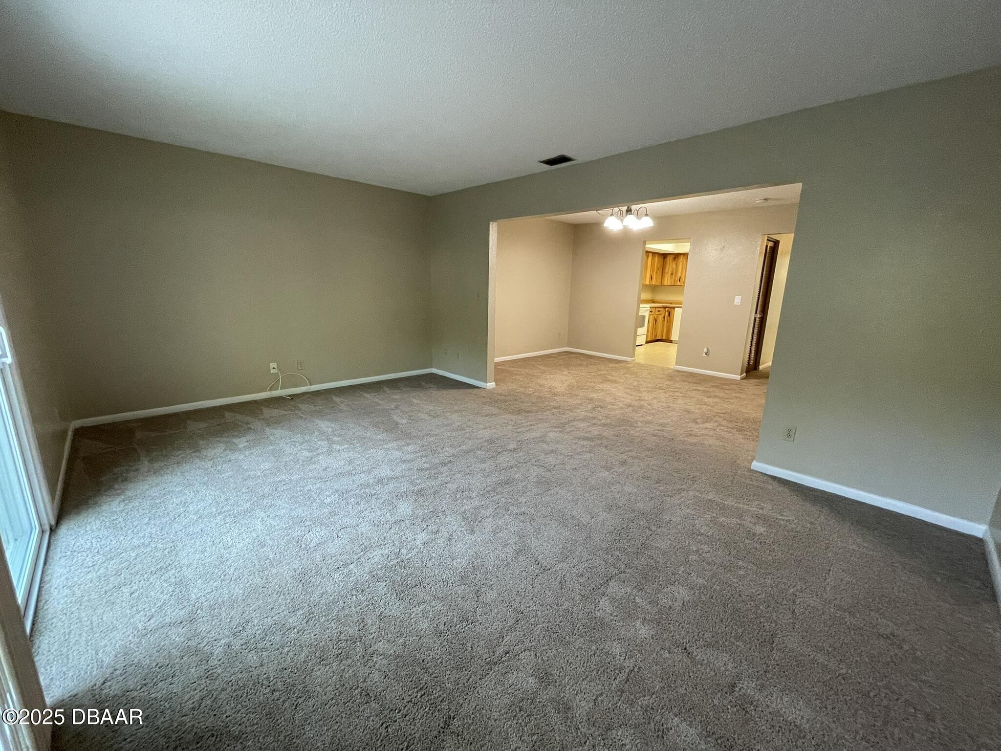 112 Tomoka Meadows Boulevard Ormond Beach, FL 32174 - Photo 24 of 53 an empty room with a window and closet