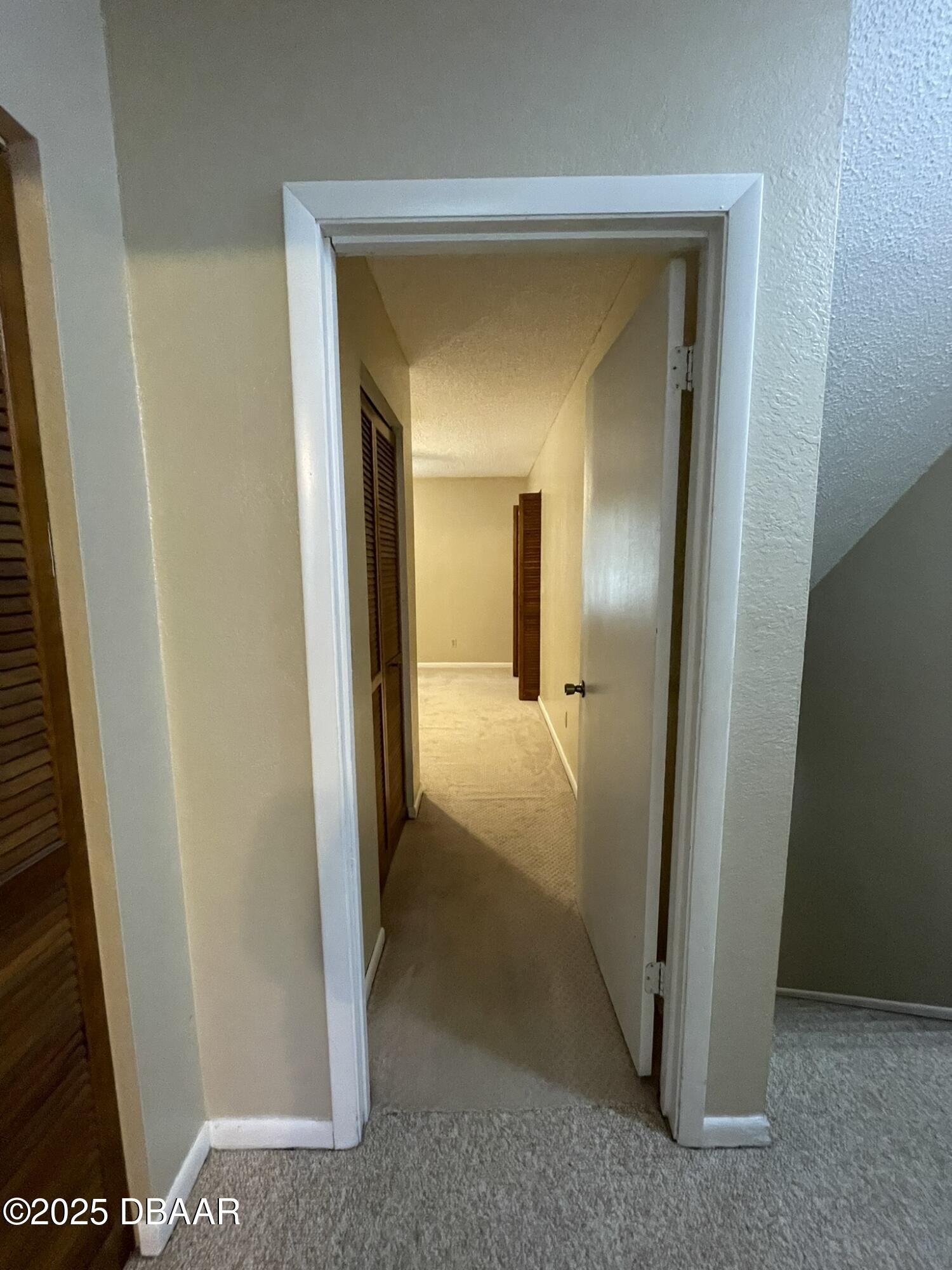 112 Tomoka Meadows Boulevard Ormond Beach, FL 32174 - Photo 30 of 53 a view of a bathroom from a hallway