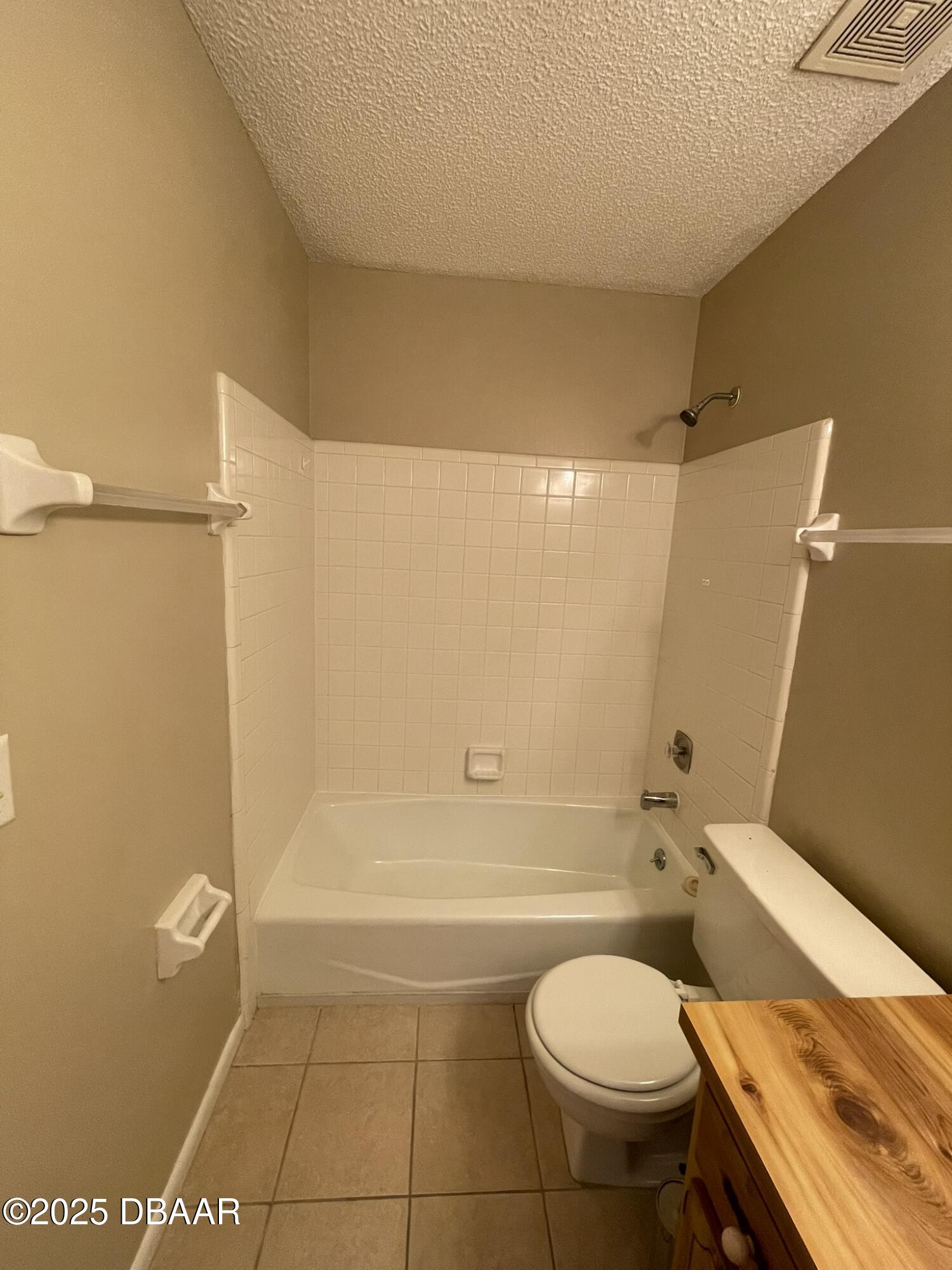 112 Tomoka Meadows Boulevard Ormond Beach, FL 32174 - Photo 42 of 53 a bathroom with a granite countertop toilet and a shower