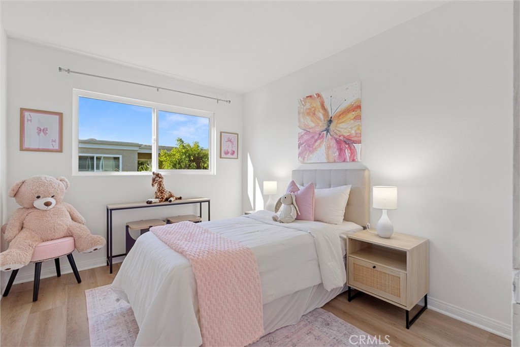 32 Kazan Street Irvine, CA 92604 - Photo 14 of 39 a bed room with a bed and a painting on the wall