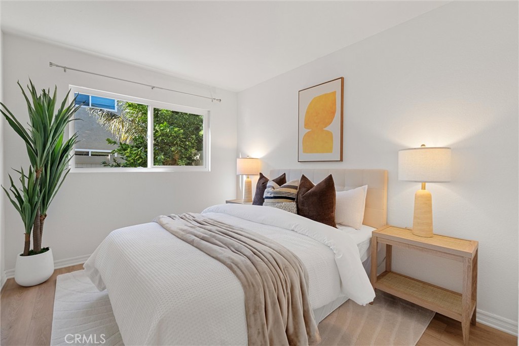 32 Kazan Street Irvine, CA 92604 - Photo 17 of 39 a bed room with a bed and a potted plant
