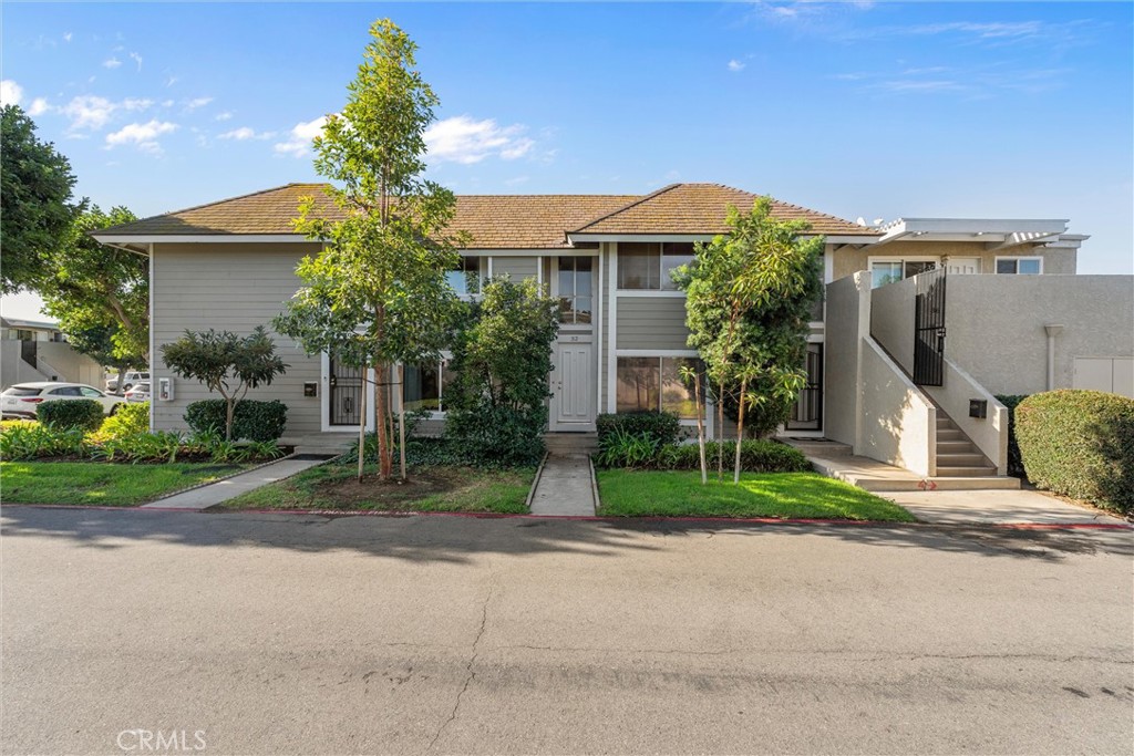 32 Kazan Street Irvine, CA 92604 - Photo 2 of 39 a front view of a house with a yard and garage