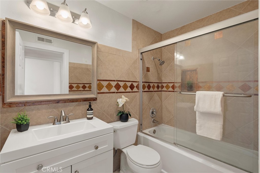 32 Kazan Street Irvine, CA 92604 - Photo 24 of 39 a bathroom with a sink a toilet and a mirror