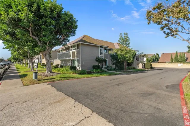 a front view of a house with a yard and a garage
