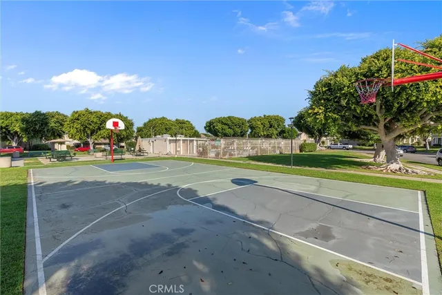 a view of green field with house in the background