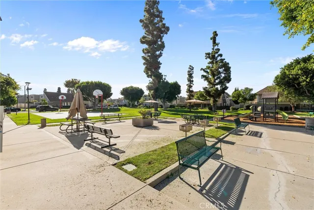 a view of swimming pool with outdoor seating and a patio