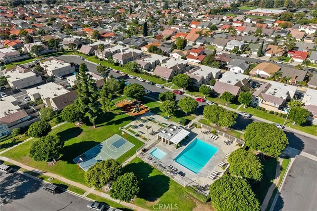 an aerial view of a house with a yard and plants