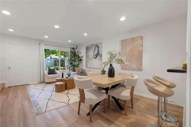 a view of a livingroom with furniture and a potted plant