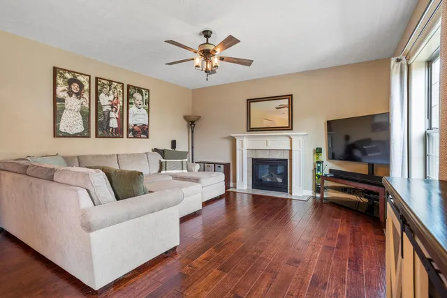 a living room with furniture fireplace and flat screen tv