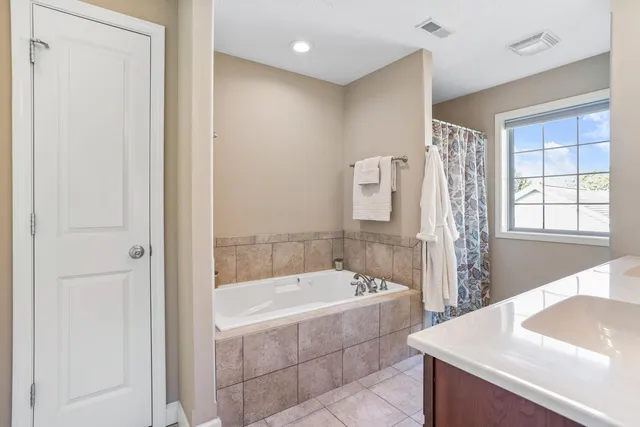 a bathroom with a bathtub and a sink