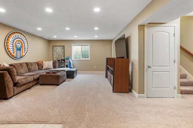 a living room with a couch and a large window