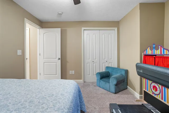 a bedroom with furniture and a gate