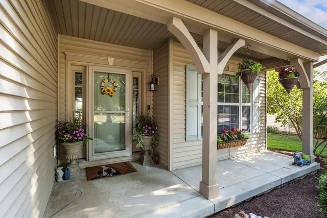 a view of a porch with seating space