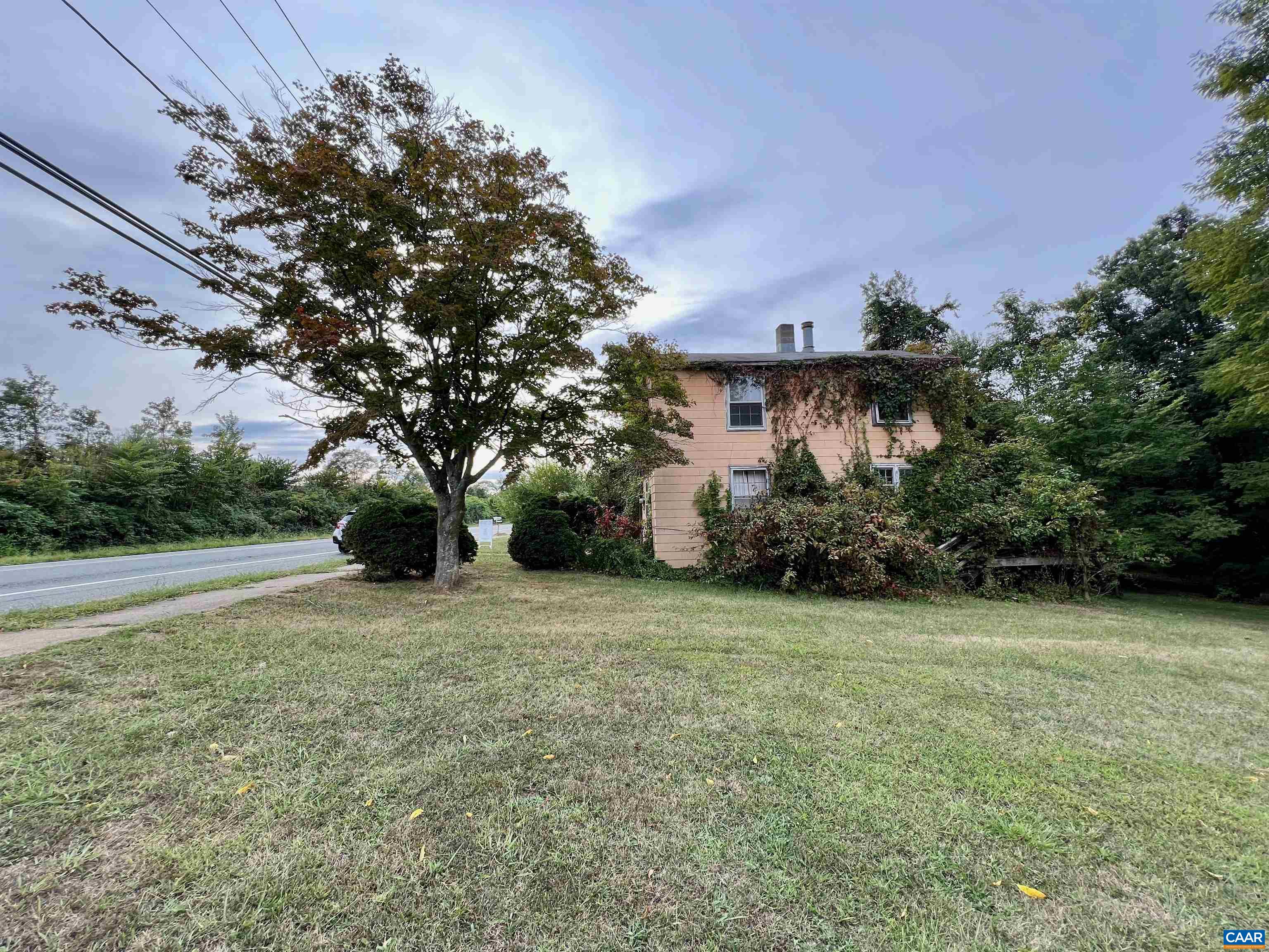 5546 Three Notched Road Crozet, VA 22932 - Photo 2 of 4 a front view of a house with a yard and garage