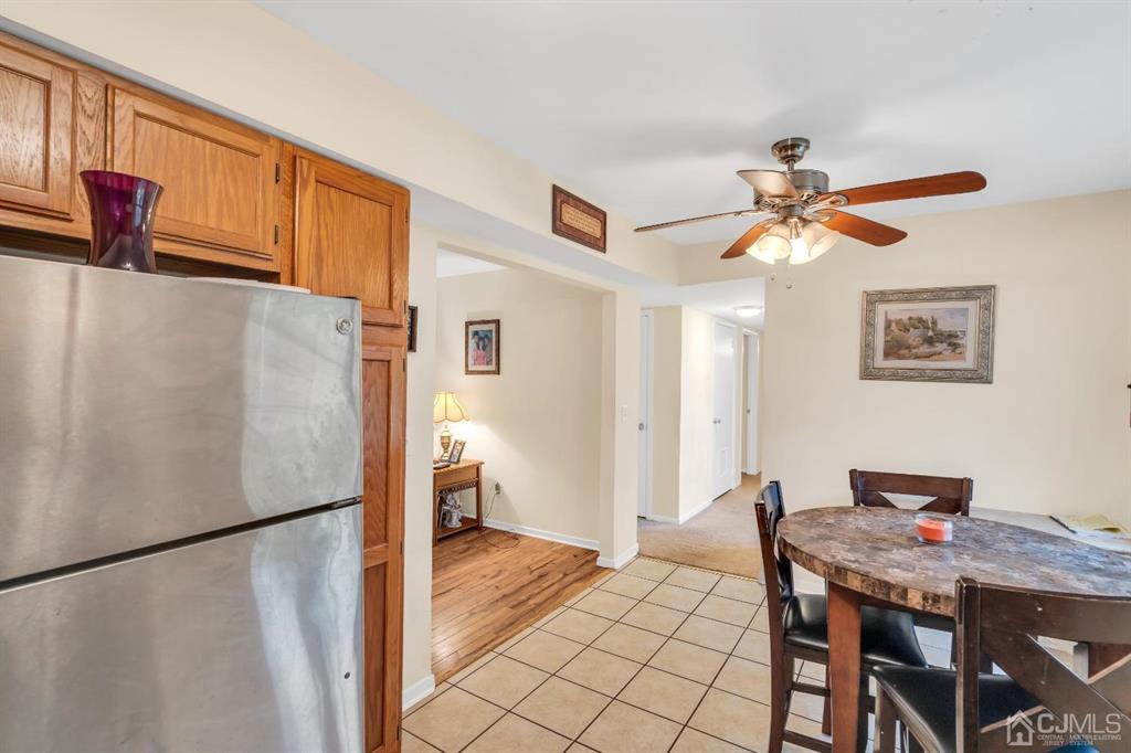 32 Hanover Square Middlesex, NJ 08846 - Photo 12 of 25 a view of a workspace with furniture and a refrigerator