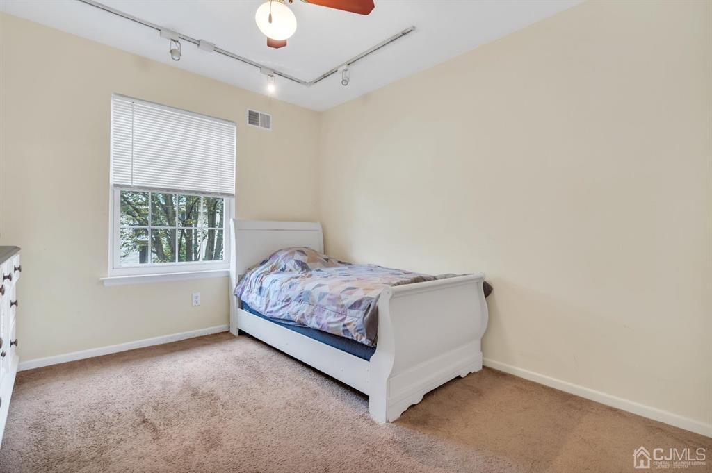 32 Hanover Square Middlesex, NJ 08846 - Photo 15 of 25 a room with a bed and window
