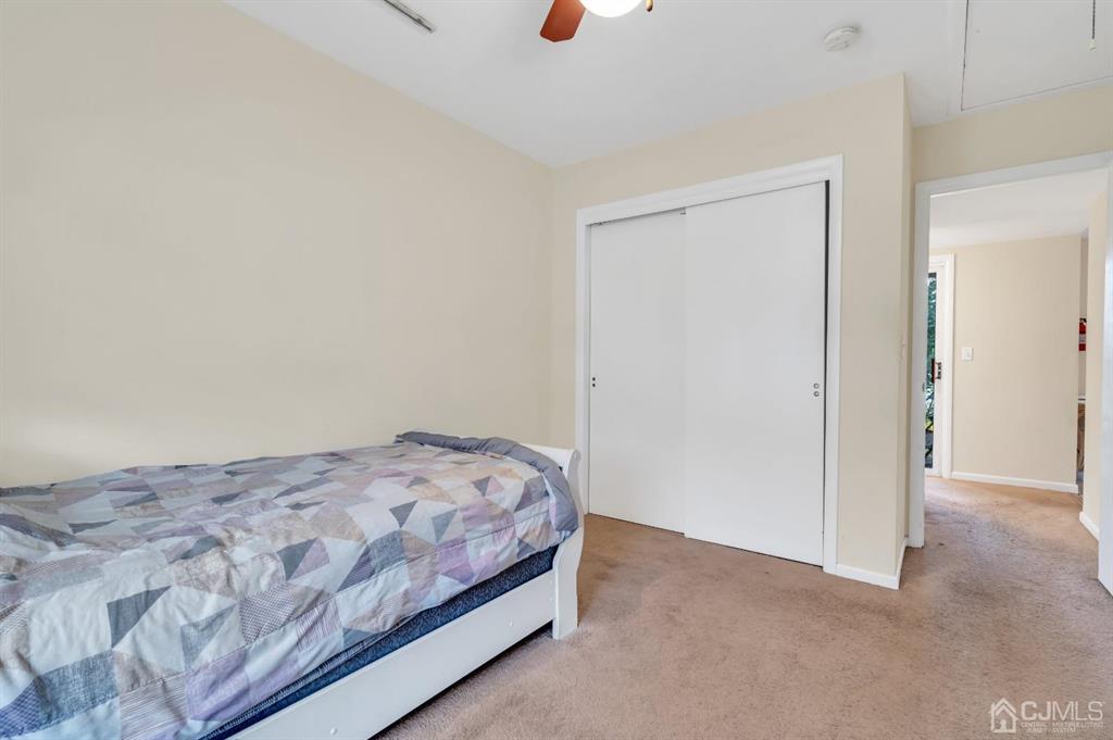 32 Hanover Square Middlesex, NJ 08846 - Photo 16 of 25 a bedroom with a bed and cabinets