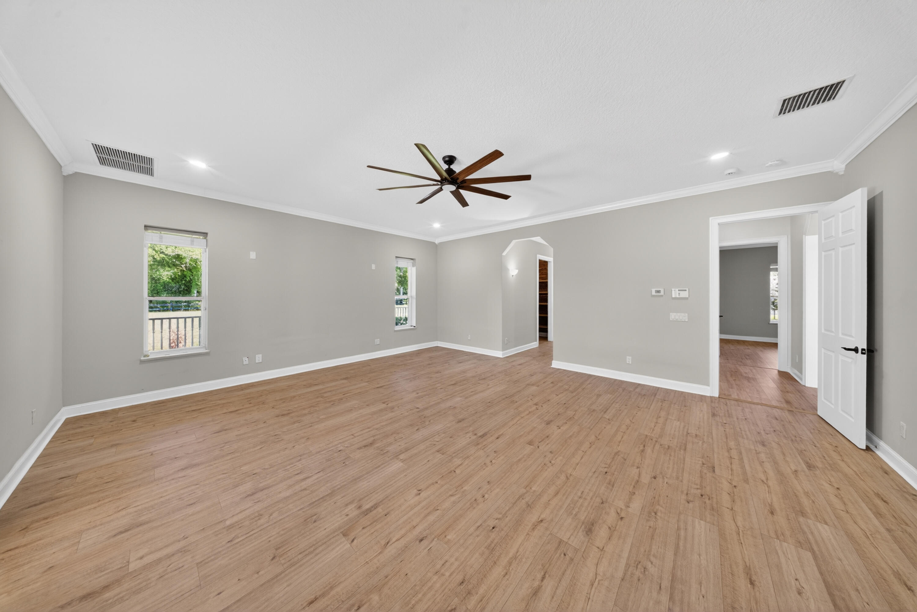 8686 Andrews Avenue Fort Pierce, FL 34945 - Photo 22 of 76 wooden floor in an empty room with a window