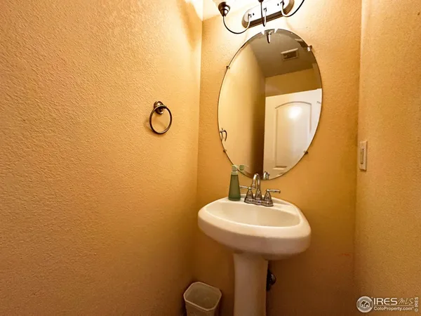 a bathroom with a sink and mirror