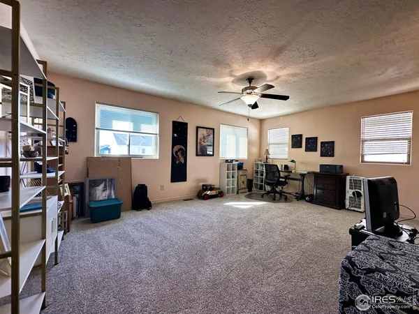 a view of a livingroom with furniture and windows