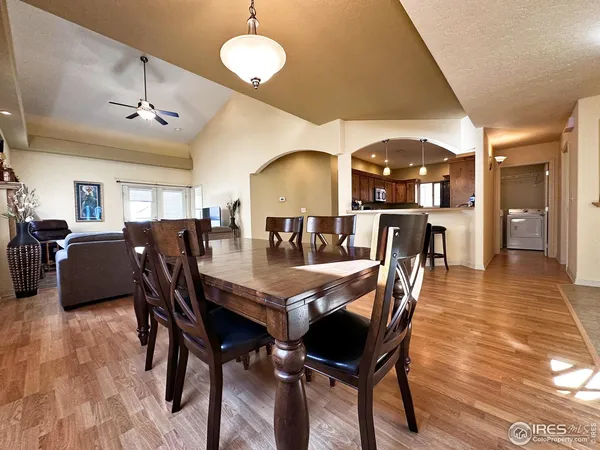 a view of a dining room with furniture and wooden floor