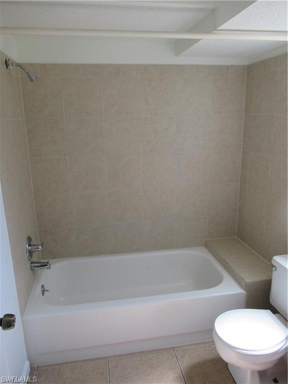 18608 Sebring Road Fort Myers, FL 33967 - Photo 11 of 13 a bathroom with a bathtub and toilet