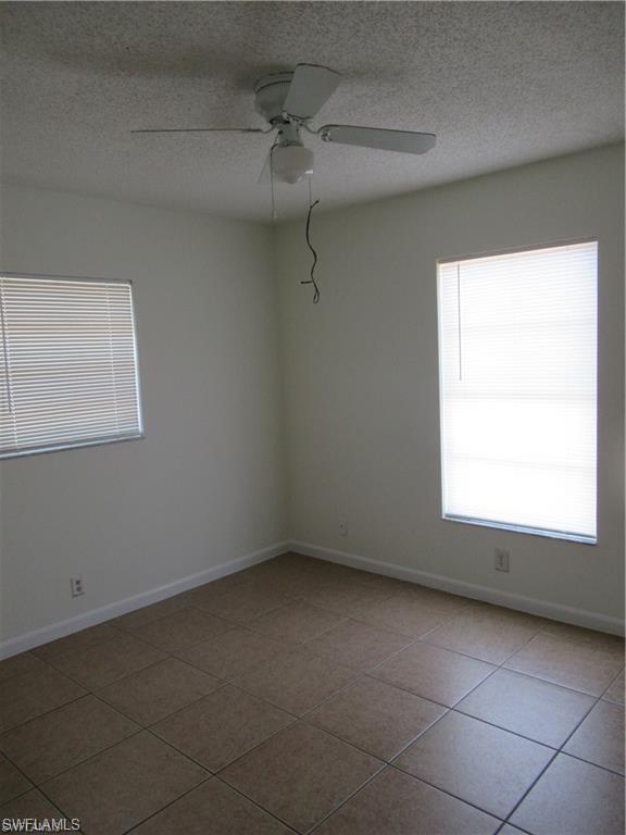 18608 Sebring Road Fort Myers, FL 33967 - Photo 12 of 13 a view of an empty room with a window