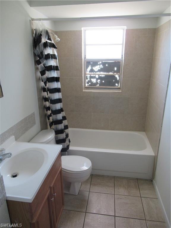 18608 Sebring Road Fort Myers, FL 33967 - Photo 13 of 13 a bathroom with a sink a toilet and shower
