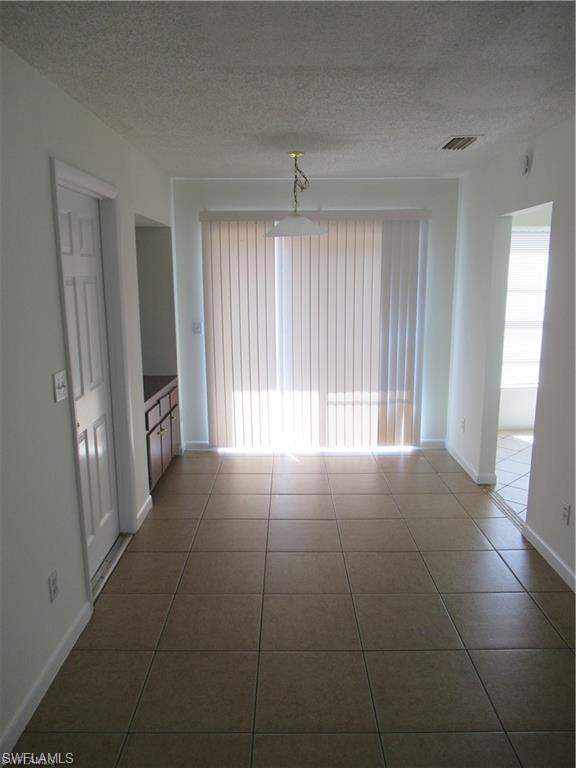 18608 Sebring Road Fort Myers, FL 33967 - Photo 4 of 13 a view of hallway with windows