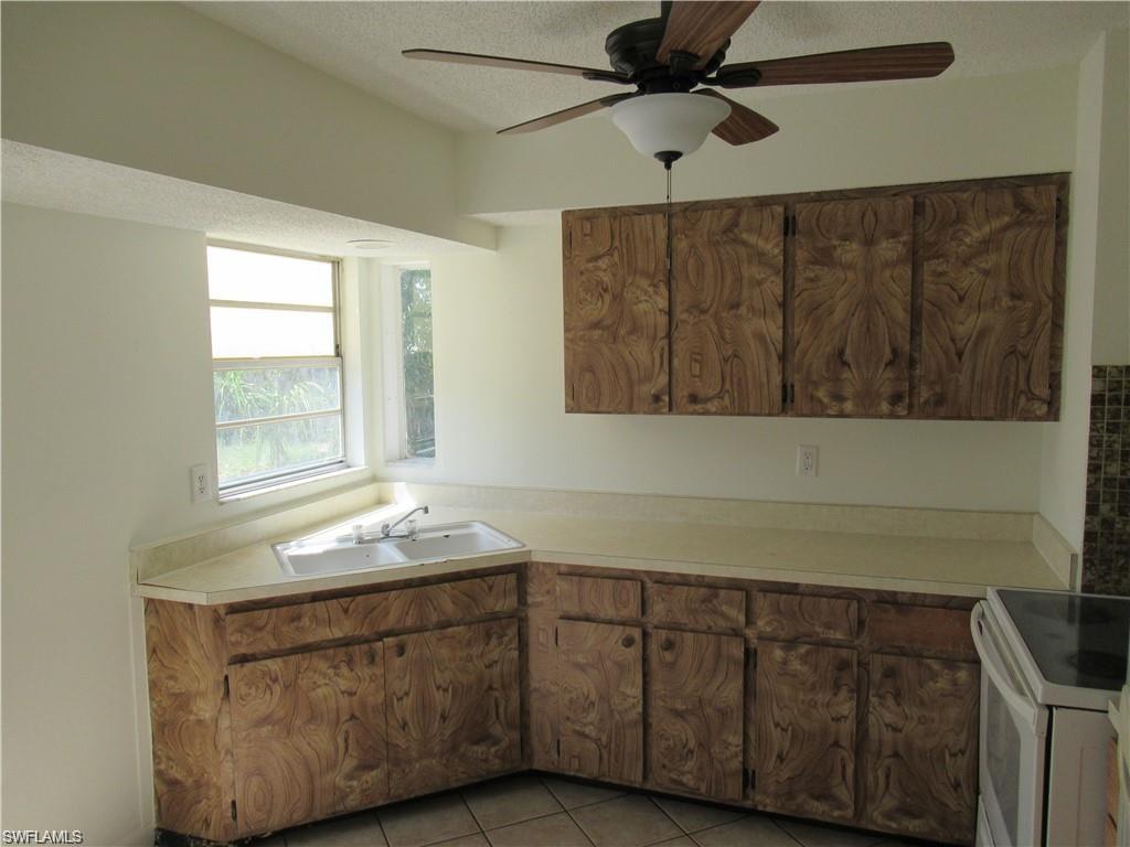 18608 Sebring Road Fort Myers, FL 33967 - Photo 6 of 13 a bathroom with a sink and a mirror
