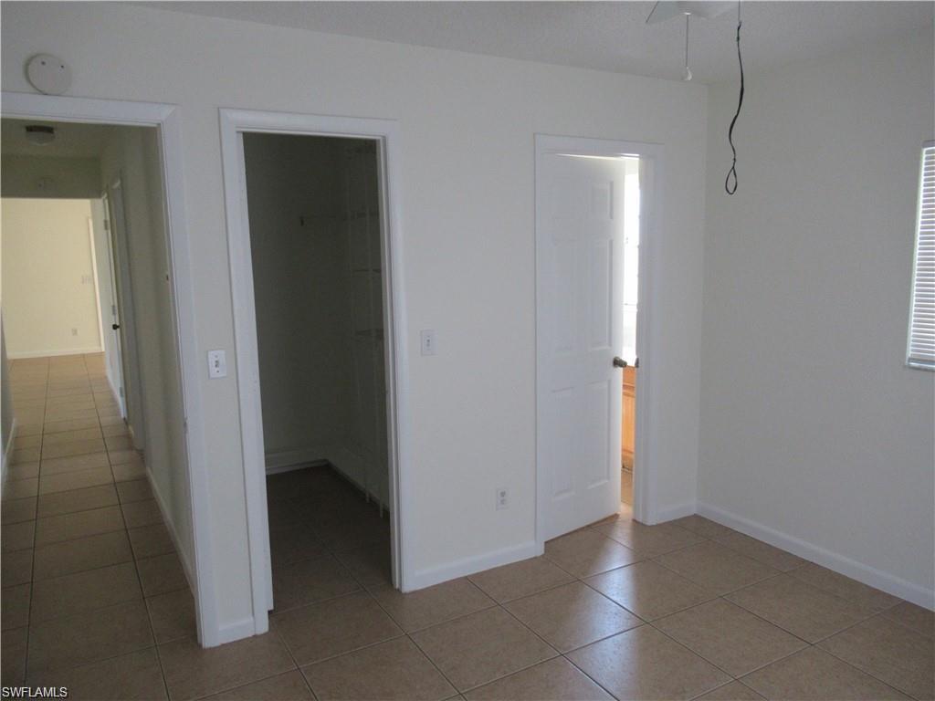 18608 Sebring Road Fort Myers, FL 33967 - Photo 8 of 13 an empty room with closet