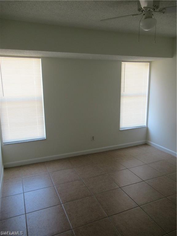 18608 Sebring Road Fort Myers, FL 33967 - Photo 9 of 13 a view of an empty room with a window