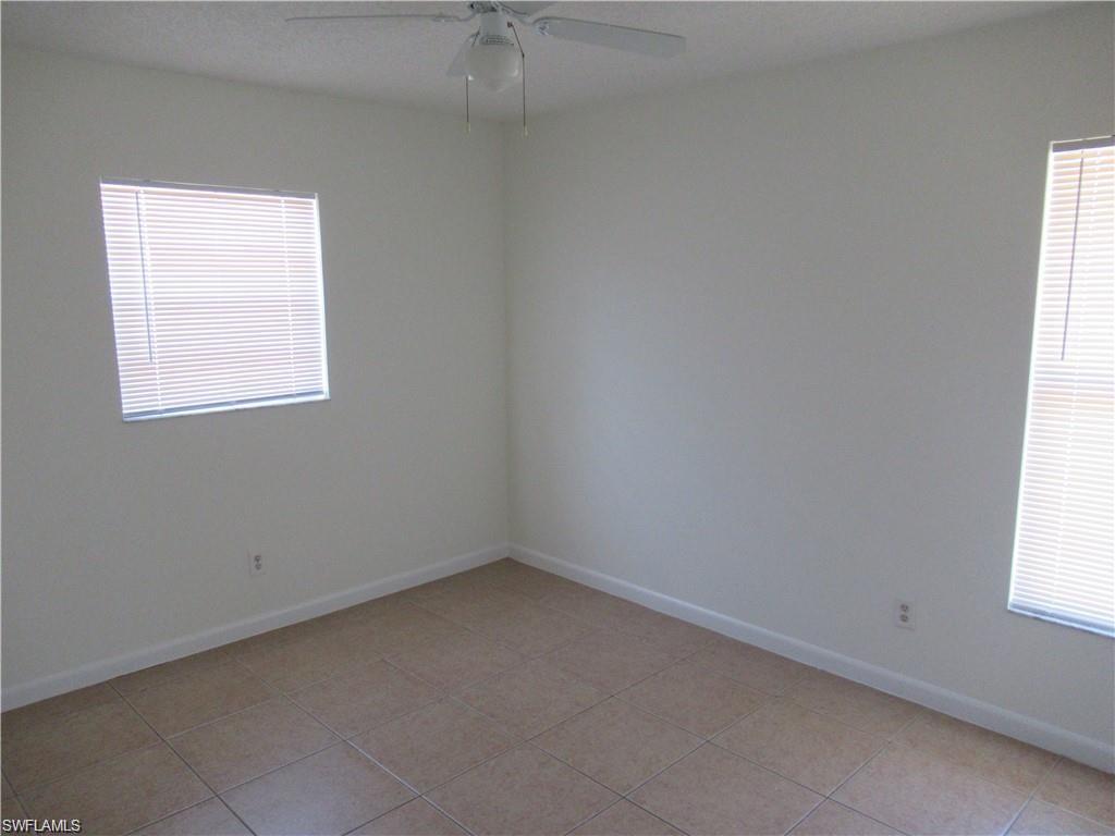 18608 Sebring Road Fort Myers, FL 33967 - Photo 10 of 13 an empty room with a window