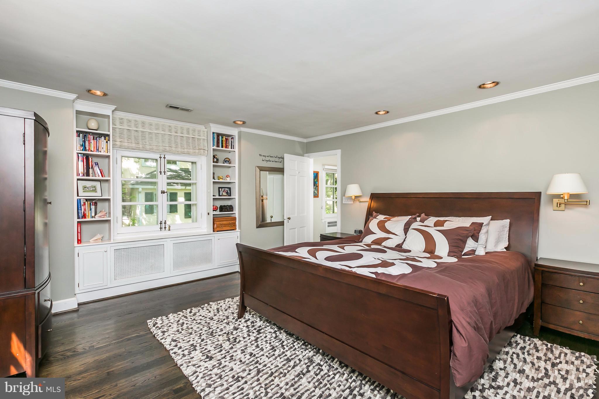 2 St Johns Road Baltimore, MD 21210 - Photo 13 of 30 a bedroom with a bed and wooden floor