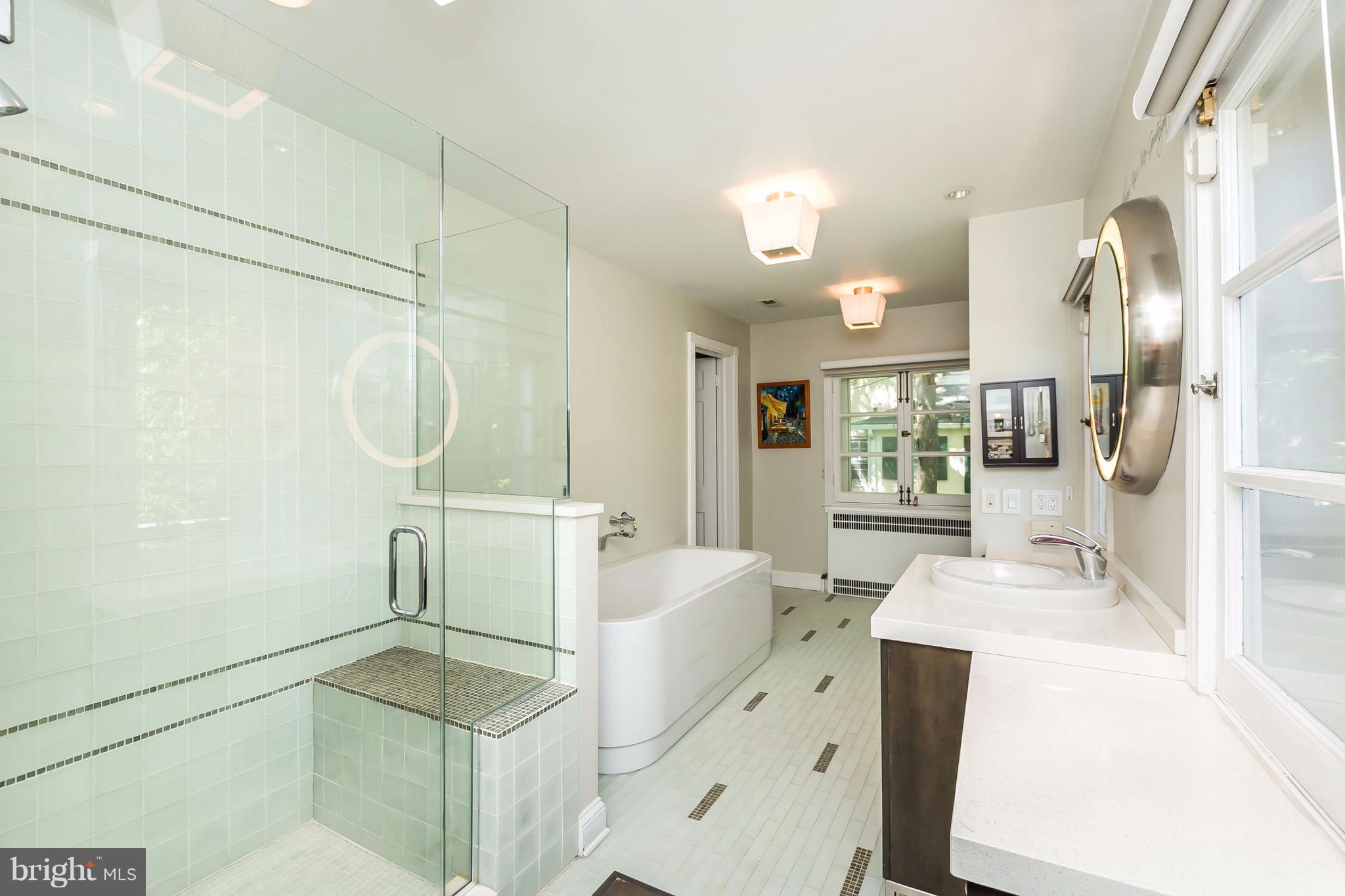 2 St Johns Road Baltimore, MD 21210 - Photo 16 of 30 a spacious bathroom with a double vanity sink a mirror and a shower