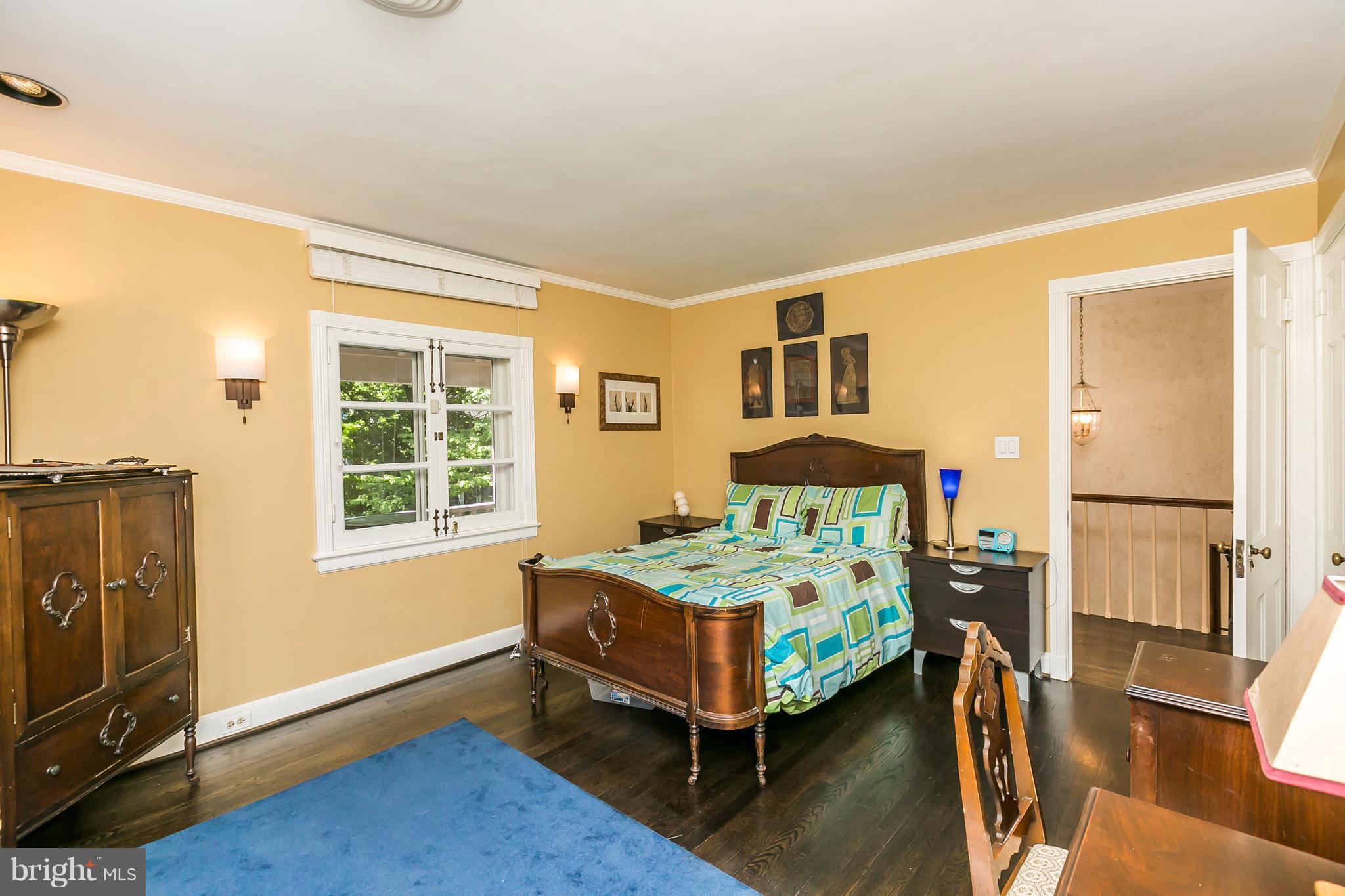 2 St Johns Road Baltimore, MD 21210 - Photo 21 of 30 a bedroom with a bed and wooden floor