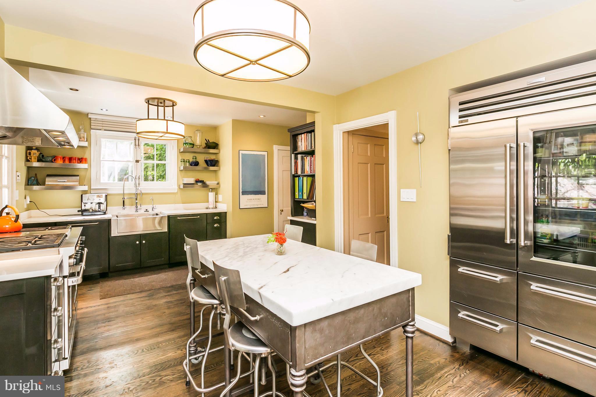 2 St Johns Road Baltimore, MD 21210 - Photo 6 of 30 a kitchen with a table and chairs