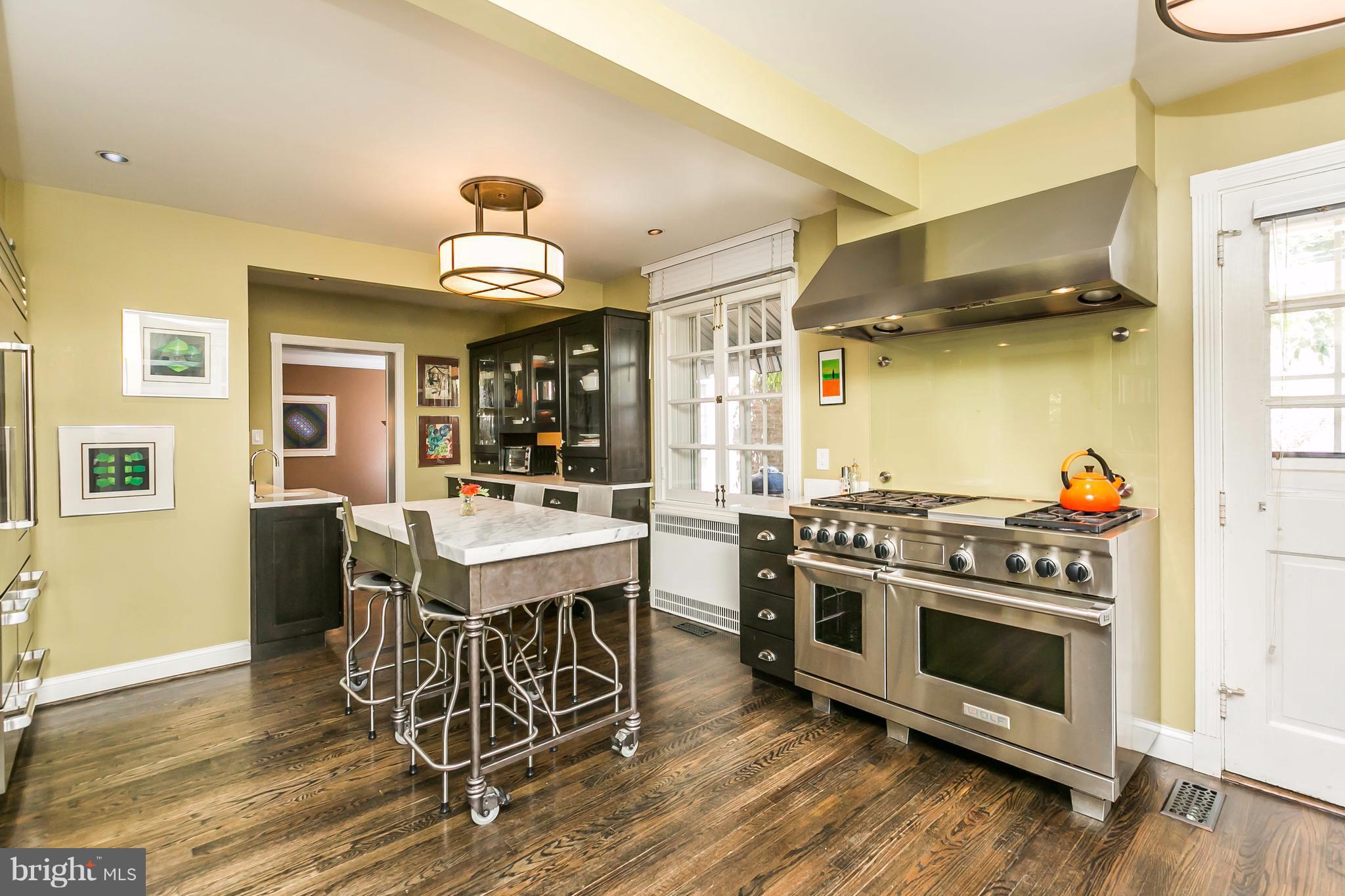 2 St Johns Road Baltimore, MD 21210 - Photo 8 of 30 a kitchen with a stove and wooden floor