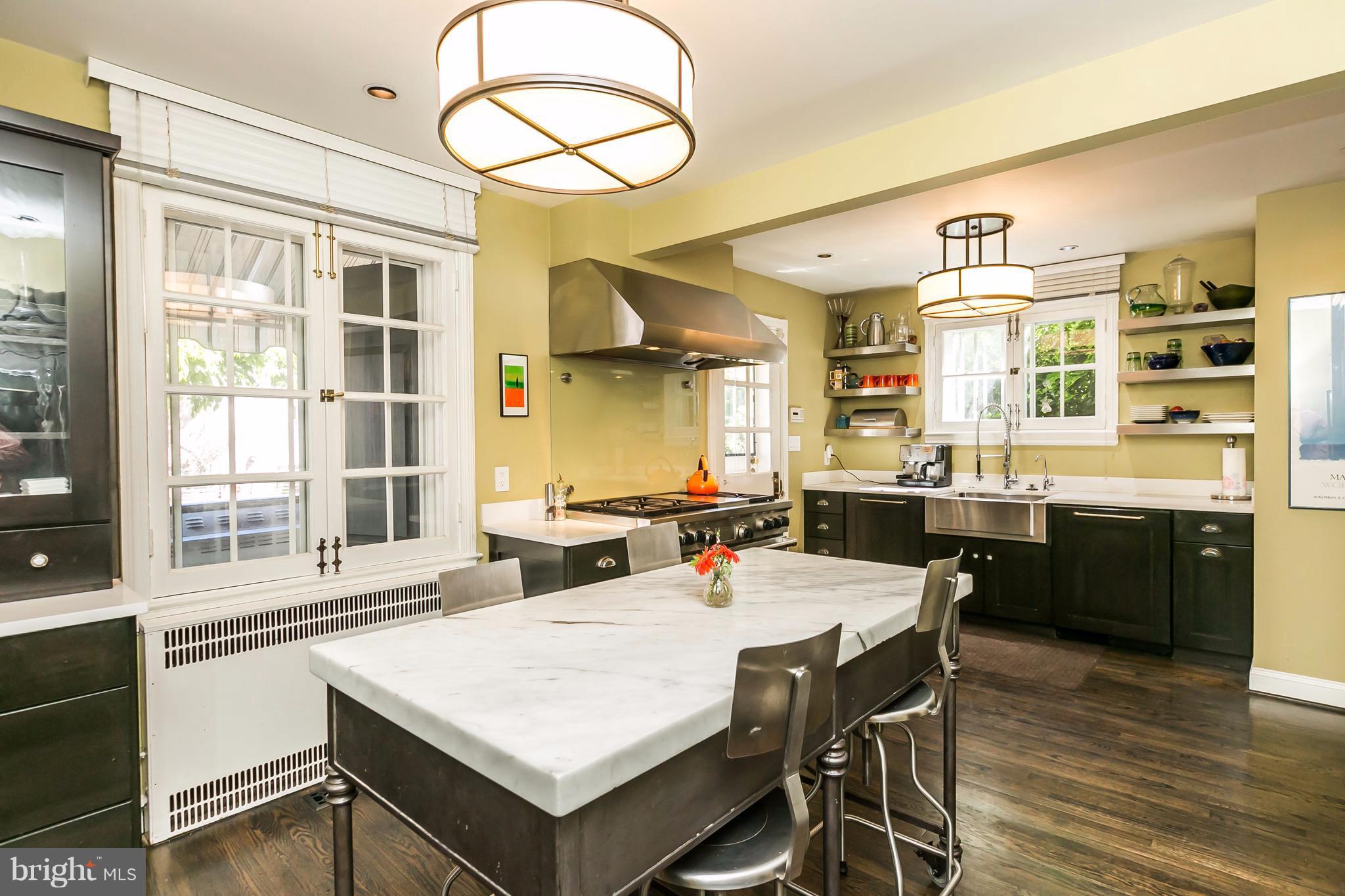 2 St Johns Road Baltimore, MD 21210 - Photo 9 of 30 a large kitchen with a table and chairs