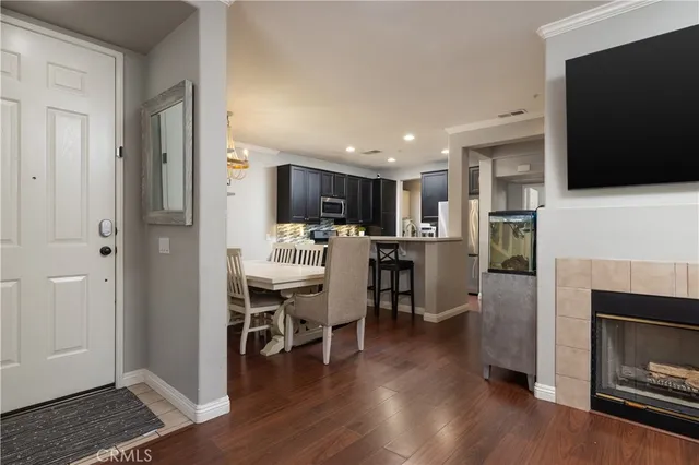 a view of kitchen with sink microwave and refrigerator