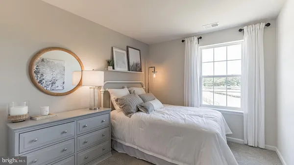 a bedroom with a bed and a closet