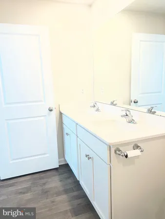 a bathroom with a white toilet and a shower